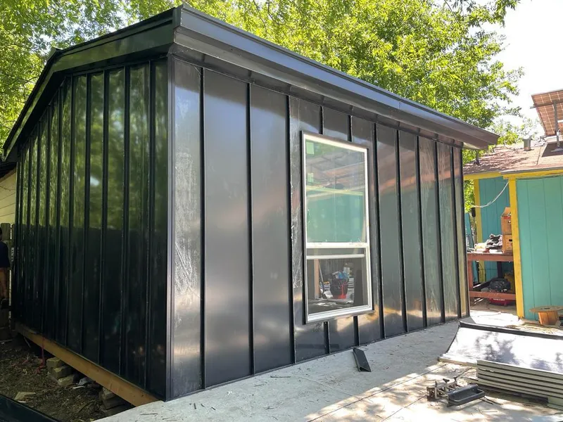 Black standing seam metal wall panels for Metal Roof Installation in St. Andrews